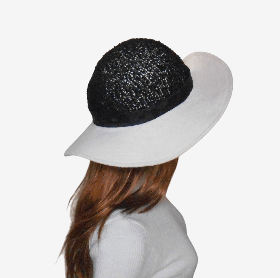 Black and white felted wide-brim hat, side view
