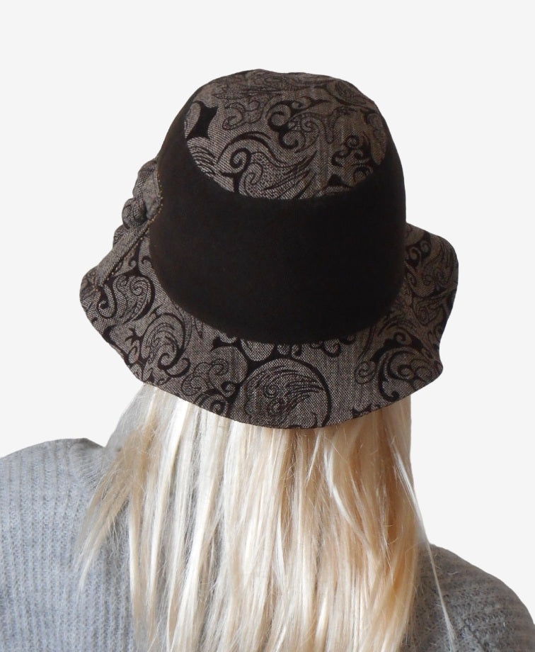 Back view of a women’s brown wool hat with narrow brim and warm lining
