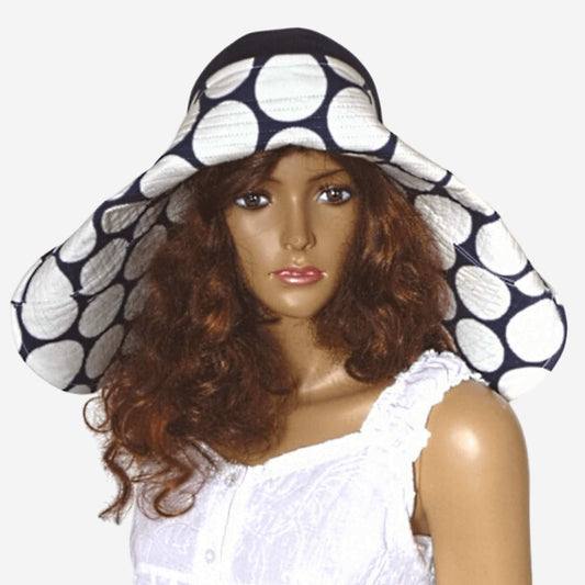 Dark blue wide brim beach hat with white polka dots