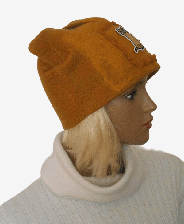 Side view of yellow felted wool cat hat showing cute cat ears
