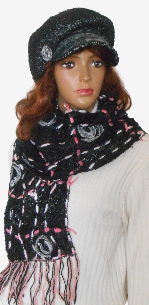 Women’s black Newsboy cap with removable brooch and long fringe scarf, front view