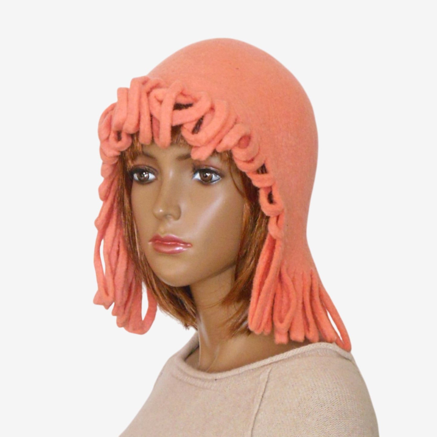 Three-quarter view of women’s coral wool trapper hat – handmade felted merino wool