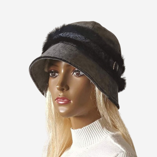 A mannequin head wearing a dark gray velor hat with a small brim and a natural fur braid around the crown

