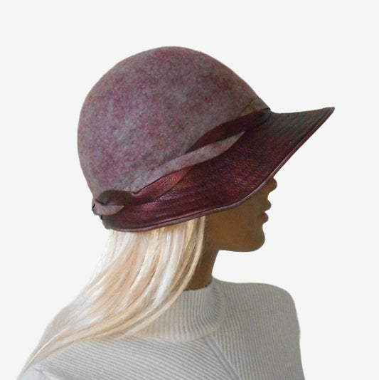 Maroon lilac felt hat with wide brim, side view.