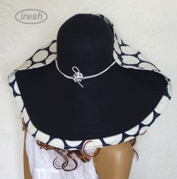 Dark blue wide brim beach hat with polka dots