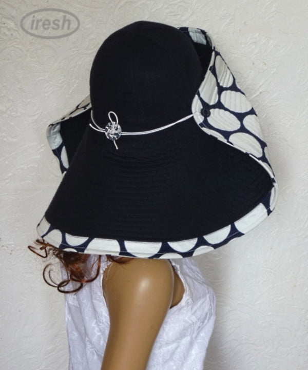 Dark blue wide brim beach hat with polka dots