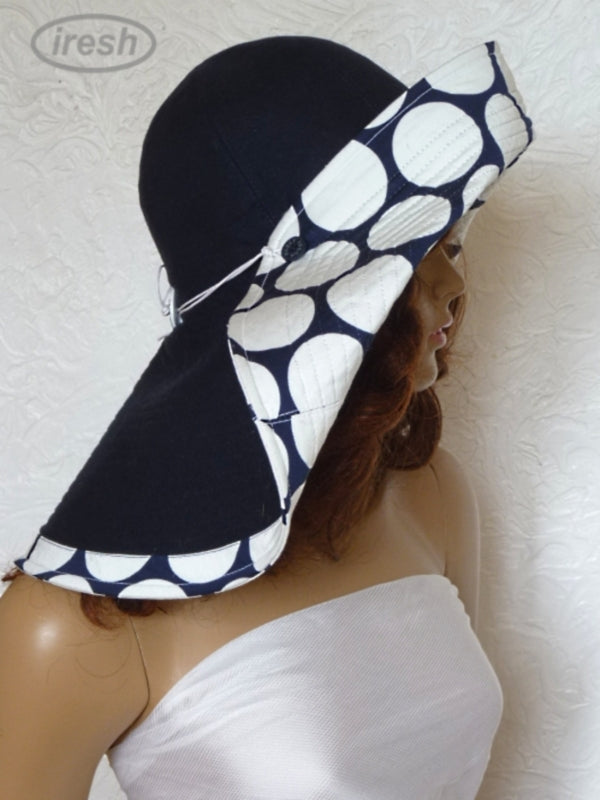 Dark blue wide brim beach hat with polka dots