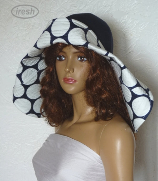 Dark blue wide brim beach hat with polka dots