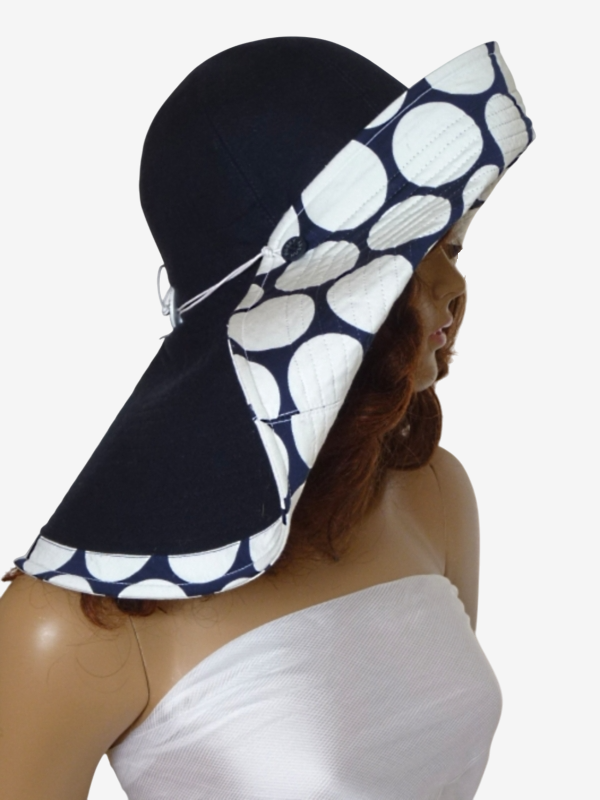 Dark blue wide brim beach hat with polka dots