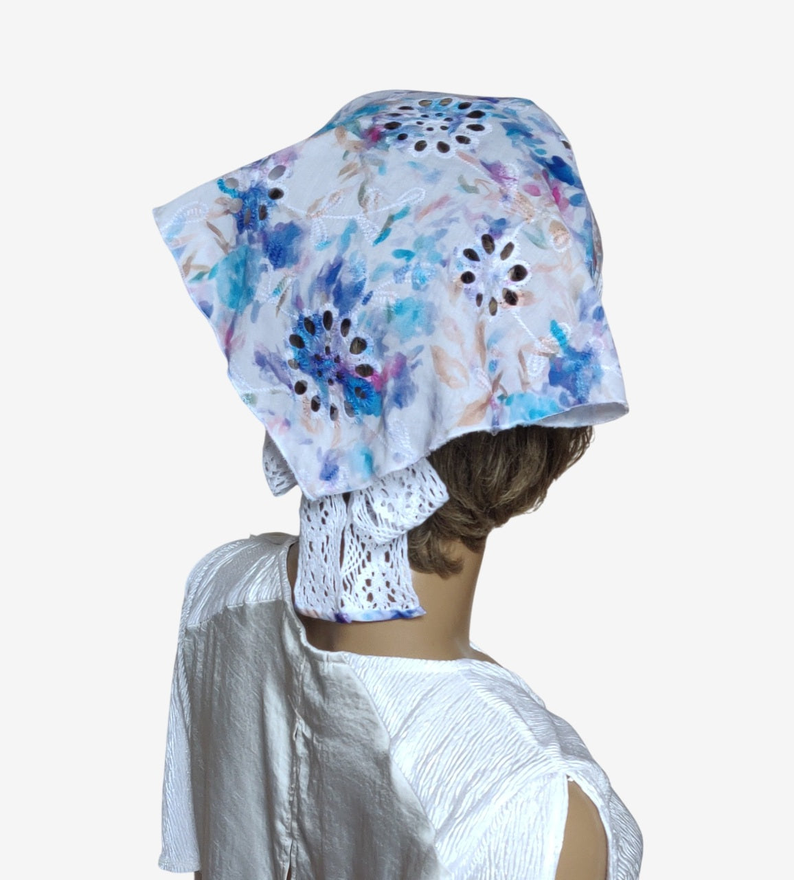 Elegant triangular sun scarf highlighting lace tie details, back view
