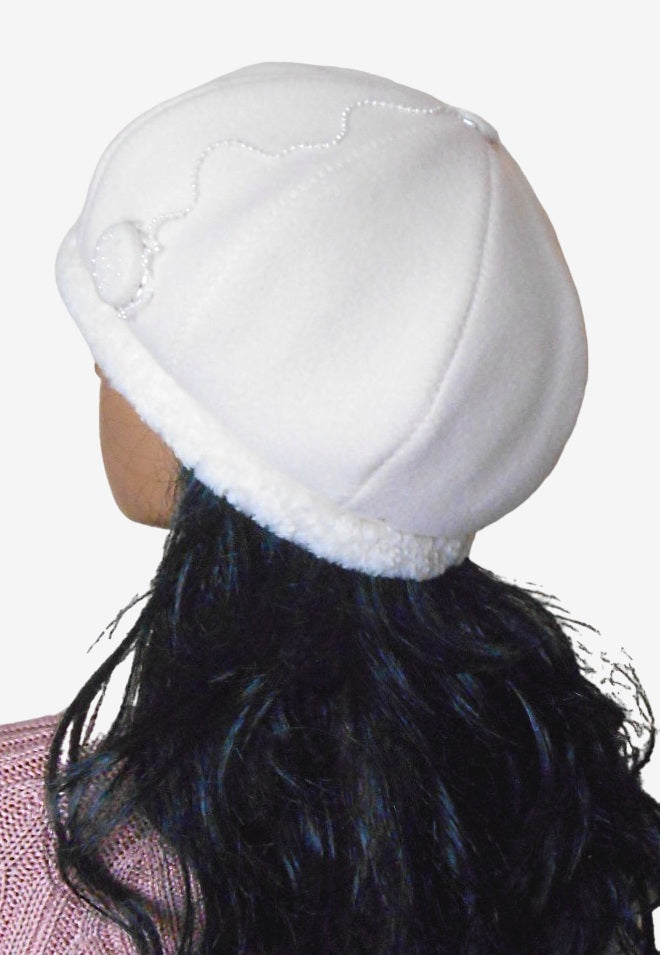 Back view of soft white wool beret with faux fur accent