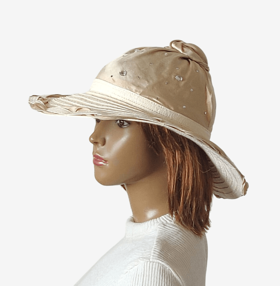 Elegant handmade beige beach hat with silk crown and decorative knot, side view