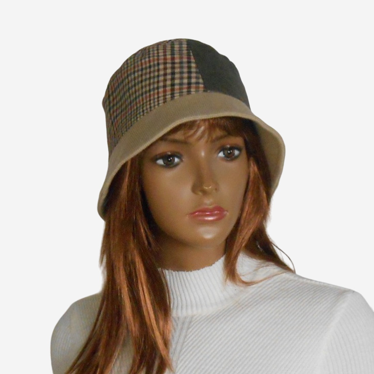 Mannequin head wearing a checkered and beige bucket hat on a white background