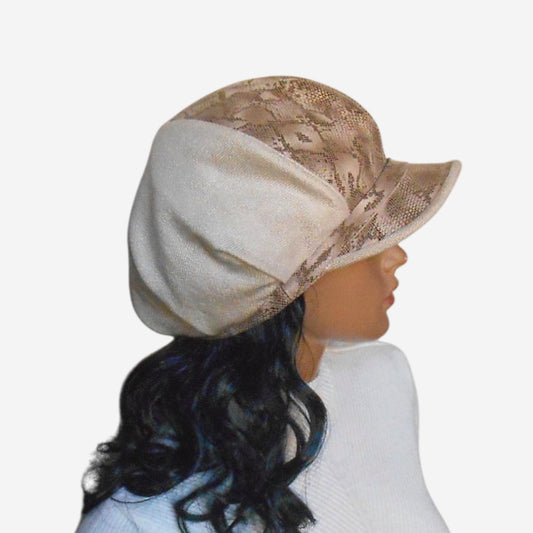 A beige Newsboy cap with a leather predator pattern 