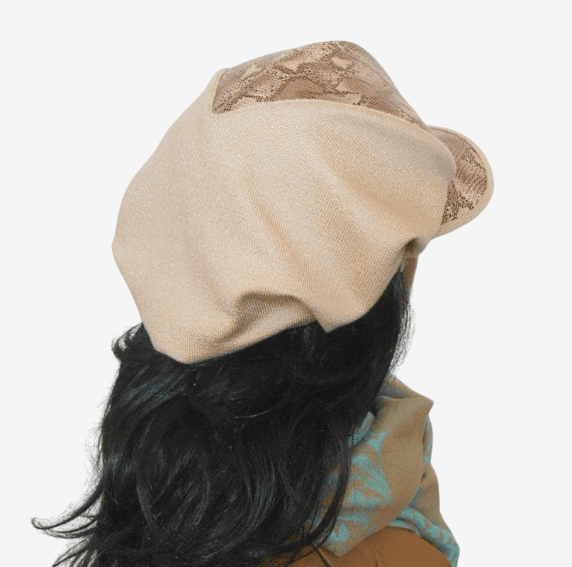 Beige leather cap predatory pattern