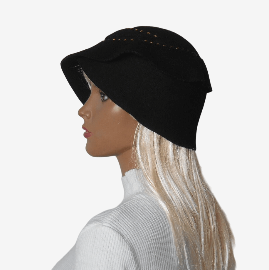 Side view of black felt hat showing asymmetrical brim and spiral ruffle detail