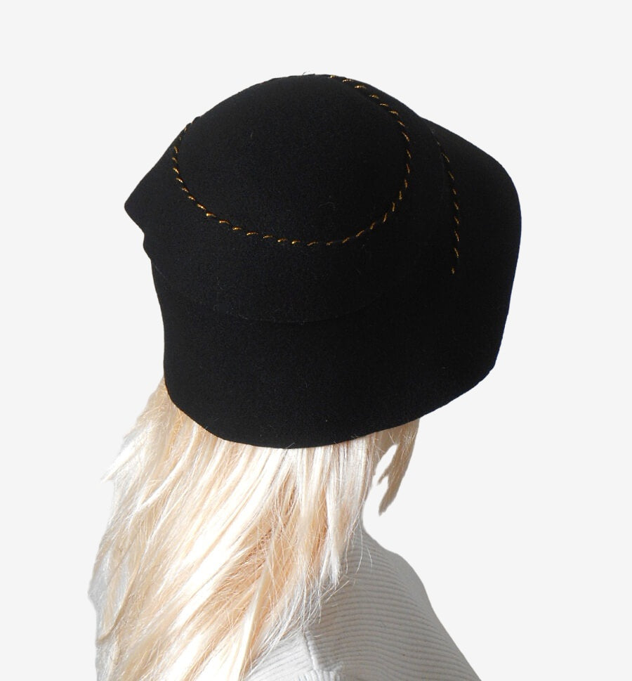 Back view of handmade black felt hat with ruffles