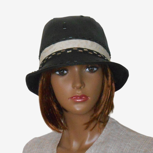 Front view of a women’s black leather hat with narrow brim for autumn and winter