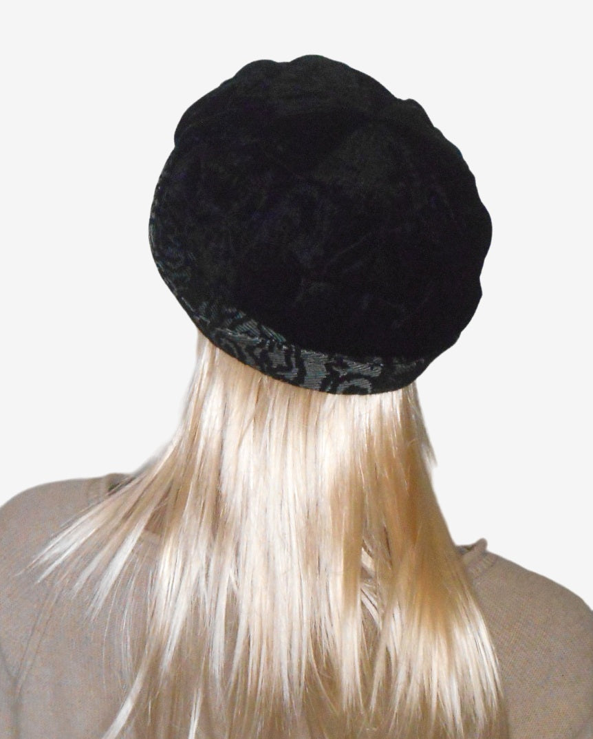 Back view of black velvet beret with brim, cozy and warm design