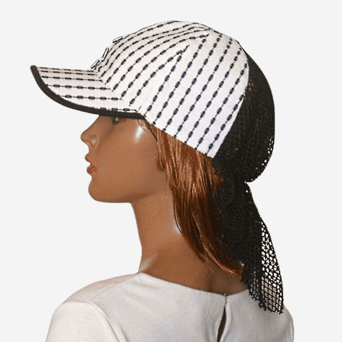 Black and white striped summer baseball cap with mesh detail, side view