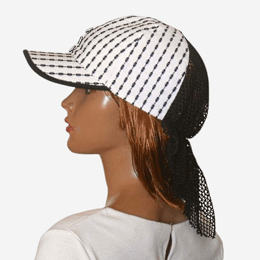 Black and white striped summer baseball cap with mesh detail, side view