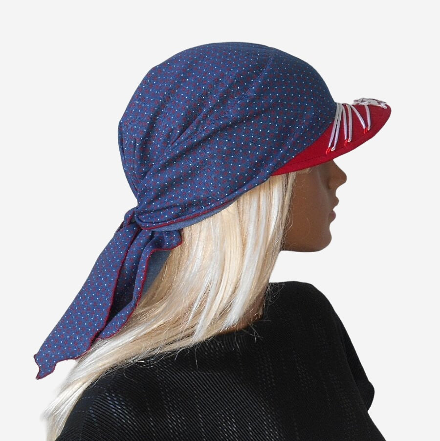 Side view of blue denim bandana with visor showing red visor and white lacing detail