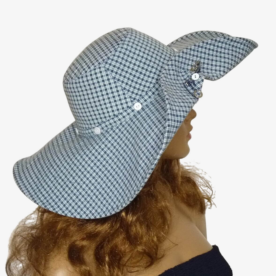 Women’s blue and white checkered cotton sun hat with wide brim, side view