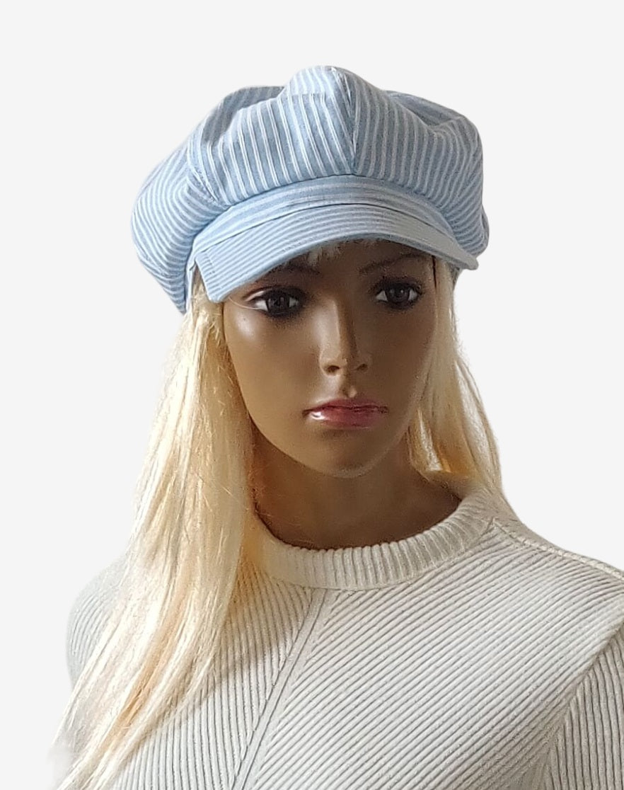 Women’s summer newsboy cap in blue and white stripes with white bow, front view