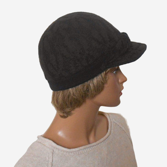 A brown felt warm cap with a small visor, displayed on a mannequin head