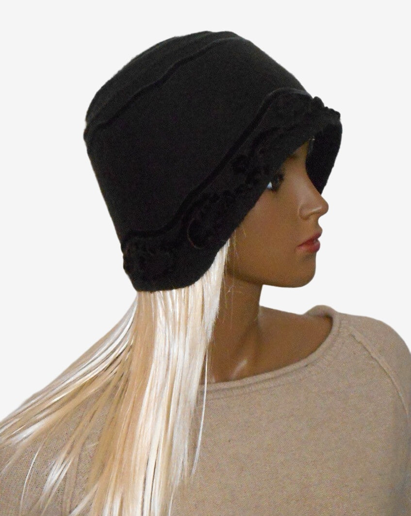 Side view of a brown felted merino wool hat with velour cord