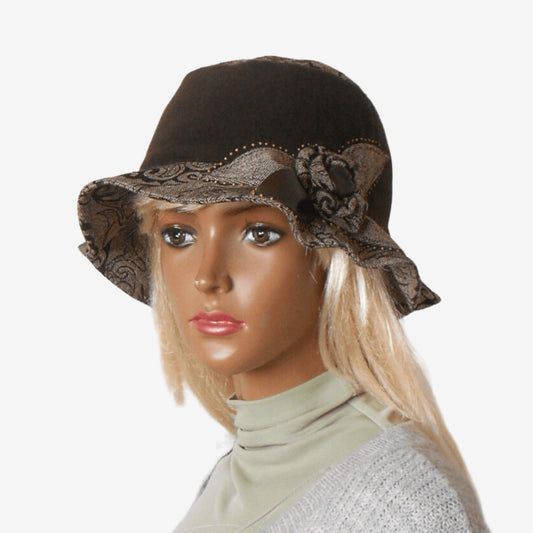 A brown wool hat with a small soft brim and lining, displayed on a mannequin head