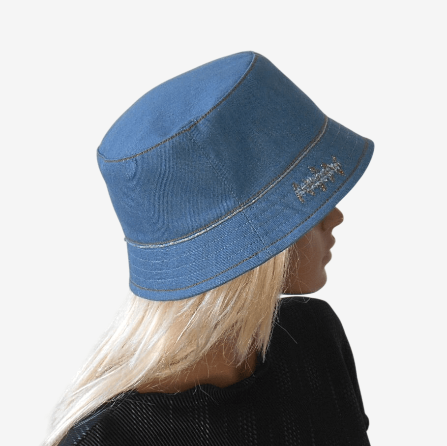 Stylish summer bucket hat with narrow gold-colored trim, side view
