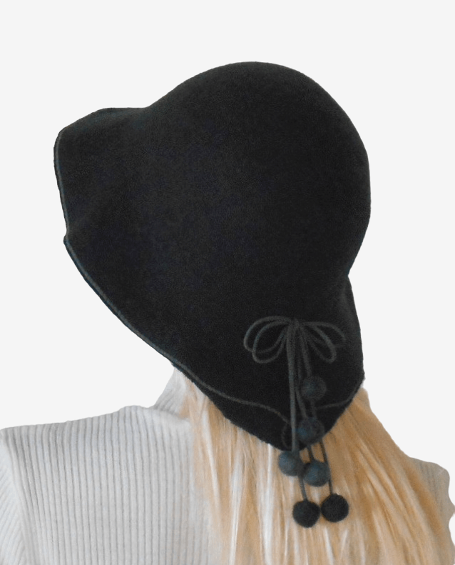 Back view of dark gray felt pom-pom hat, minimalist winter felt hat for women
