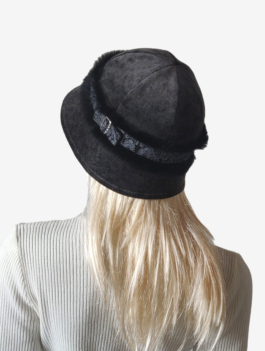 Back view of a women's dark gray hat showing elegant design and fur braid detail