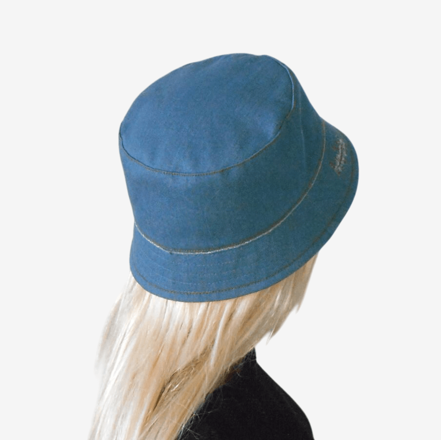 Women's denim bucket hat with decorative golden-colored braid, back view