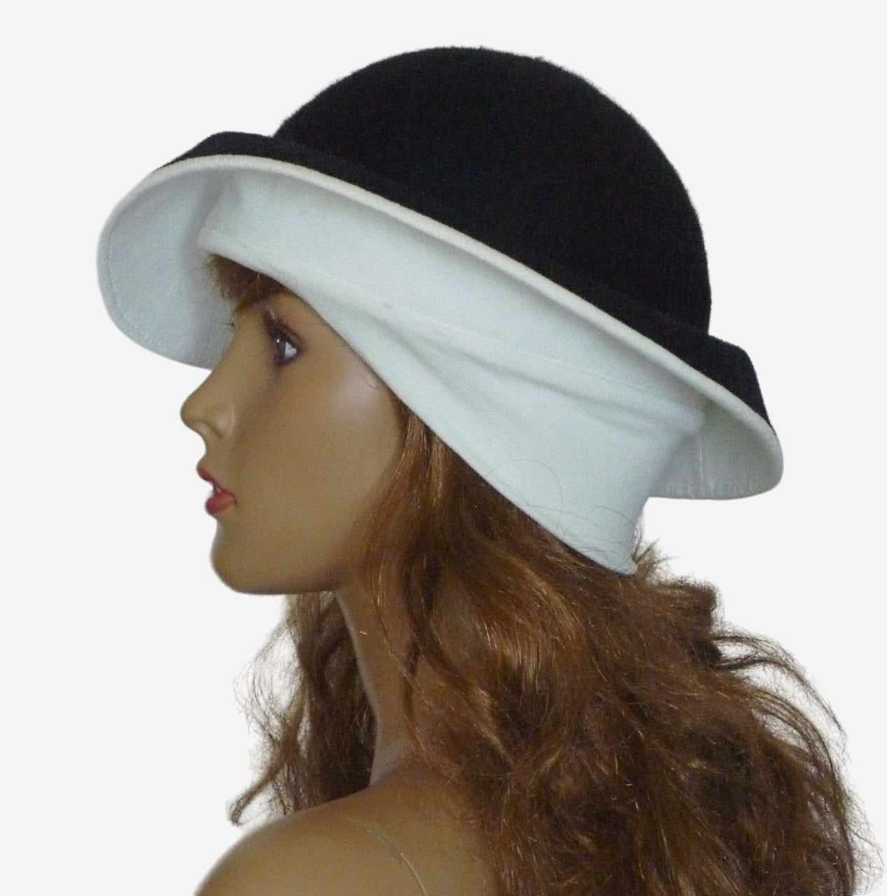 Side view of handmade black and white felt winter hat