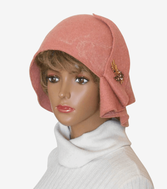Felted pale pink hat with asymmetrical brim, front view – stylish handmade women’s winter hat