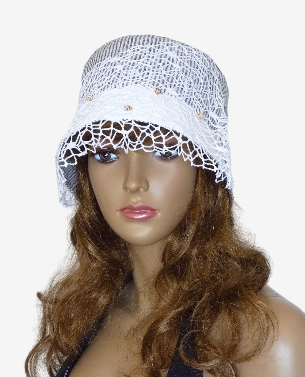 Front view of gray and white striped summer hat with veil and seashell decoration