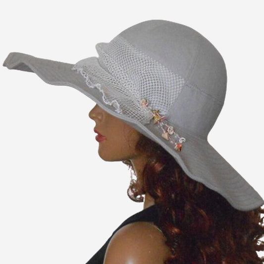 Gray linen wide brim hat decorated with mesh and sea shells