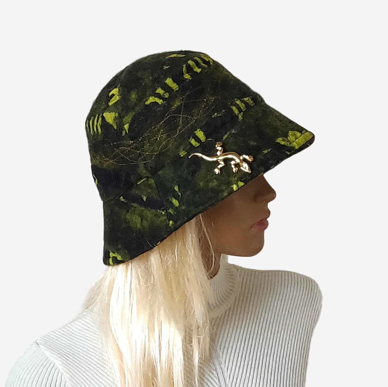 Side view of hand-felted green wool bucket hat in dark green, black, and light green colors