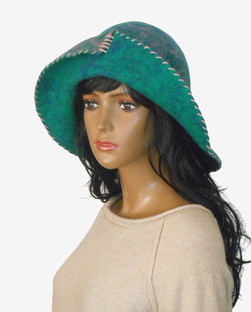 Handmade green felt floppy hat with wide brim, three-quarter view
