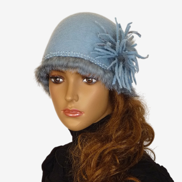 Light blue felted beanie hat with flower and fur trim front view