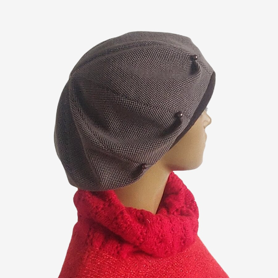 Side view of slouchy oversized brown beret showing relaxed fit