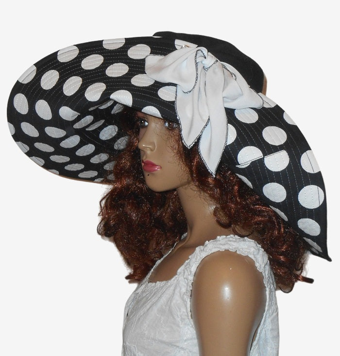 Side view of black and white polka dot wide brim sun hat
