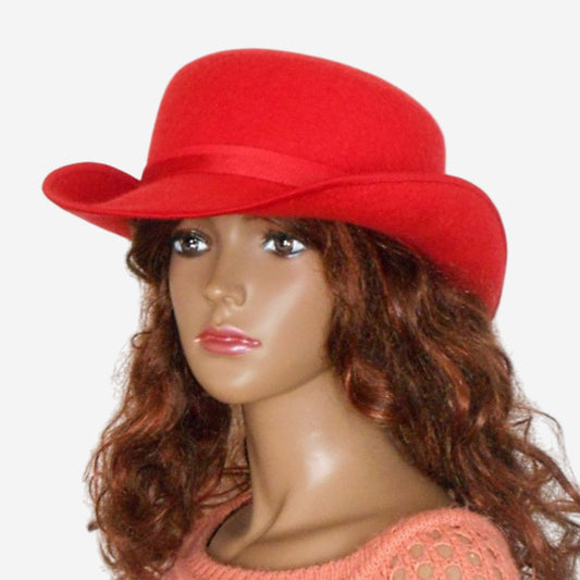 Handcrafted red felted bowler hat, view from three-quarters, cozy and stylish
