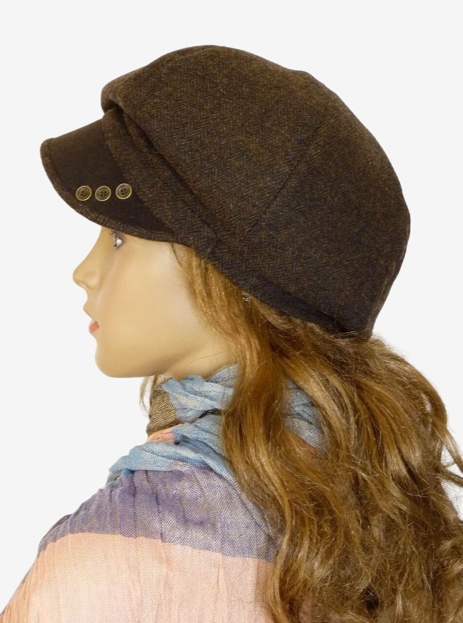 Side view of dark brown tweed newsboy cap with buttons