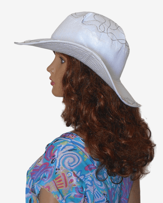 Side view of silver linen hat showing decorative silver cord along brim