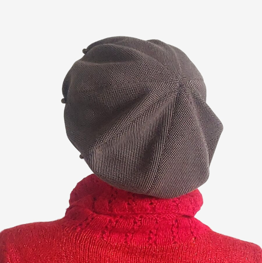 Back view of slouchy oversized brown beret with pleats
