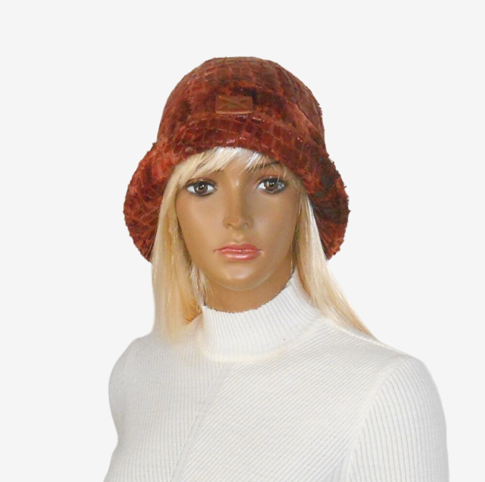 Front view of a women's terracotta cloche hat in 1920s style with a small raised brim
