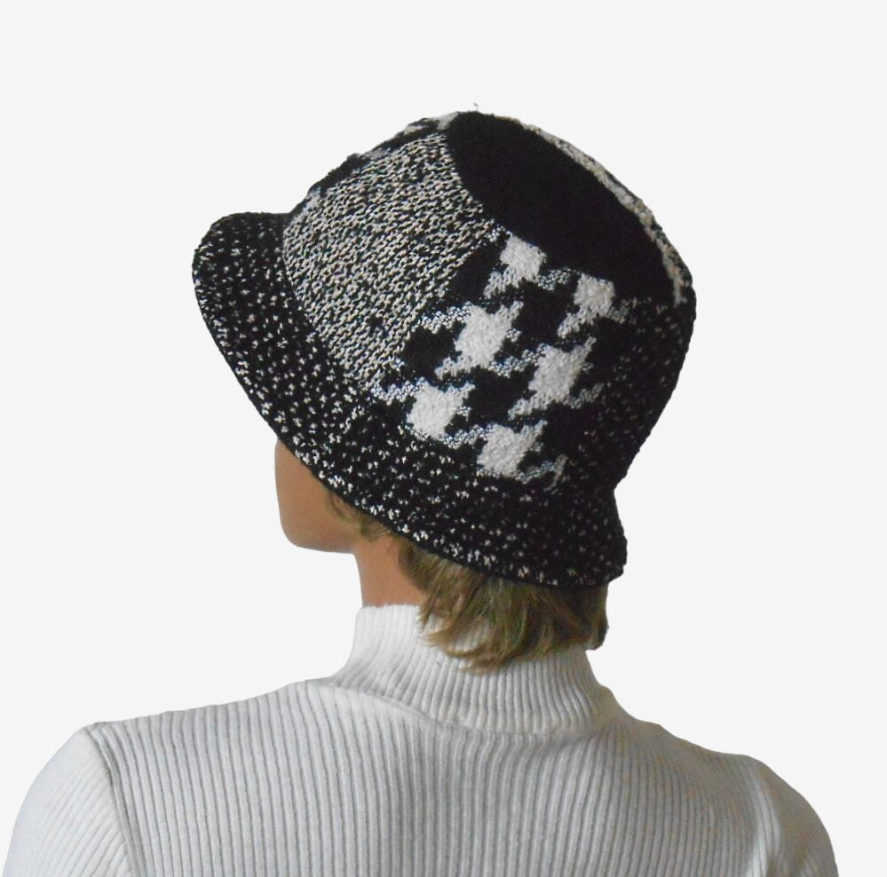 Three-quarter view of warm wool bucket hat with black and white pattern